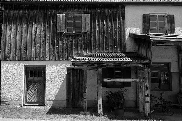 Detail of a historical house built in style peasants baroque in 1861.. Very well preserved building, part of UNESCO World Heritage Sites. Blue sky with white clouds. Holasovice, Czech repbulic.