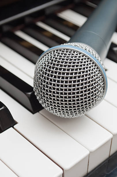 istock Microphone on the keyboard of piano 176823572