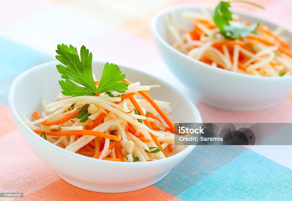Kohlrabi and carrot salad Kohlrabi and carrot salad with pine nut,parsley and green onion Appetizer Stock Photo