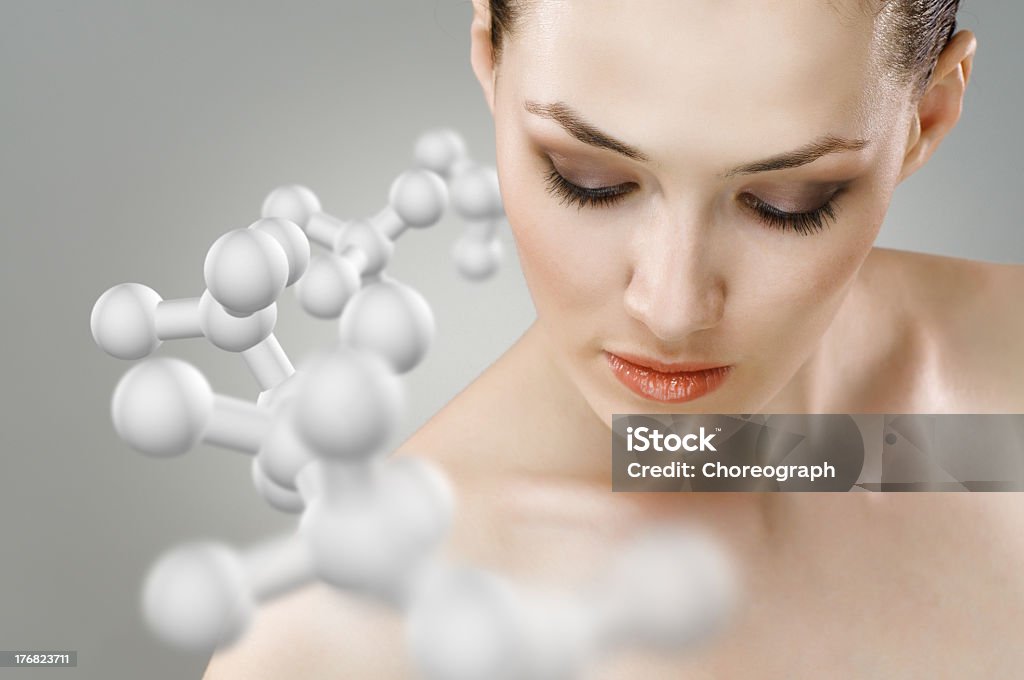 Portrait of a woman with molecules around her beauty girl on the grey background Molecular Structure Stock Photo