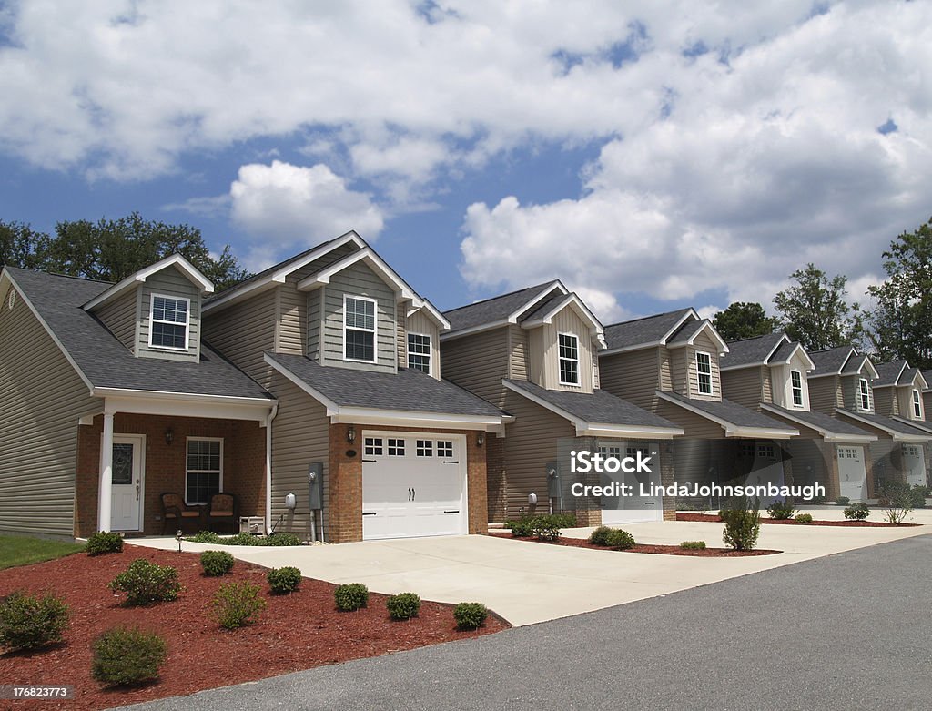 Low Income Retirement Condos or Complex Two story low income retirement homes with the garage in the front. Townhouse Stock Photo