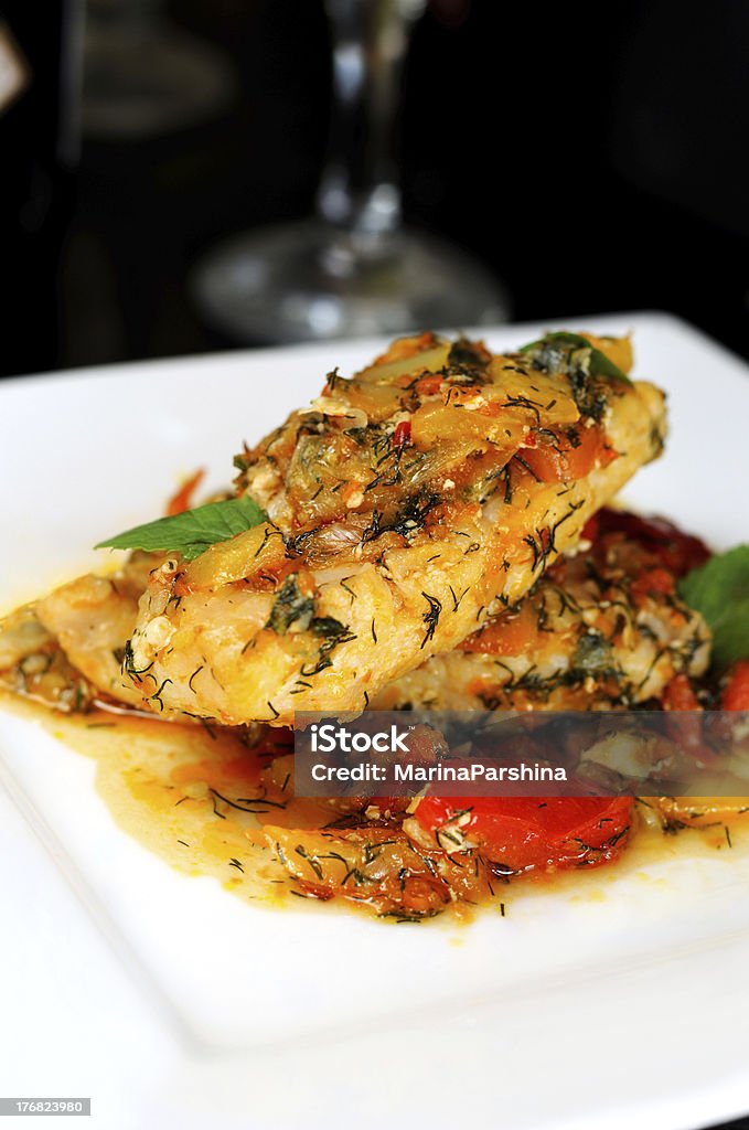 Braised filletted fish with vegetables. Braised Stock Photo