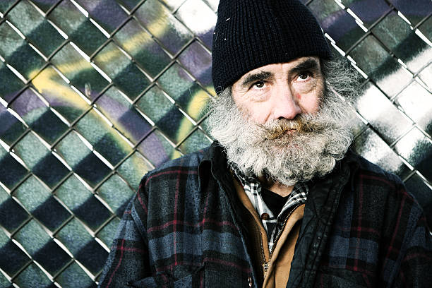 istock Old Man Looking up Near Fence 176824007