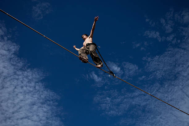 Man Walking High Slackline stock photo