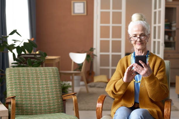 istock Senior woman using smartphone at home 1768241833
