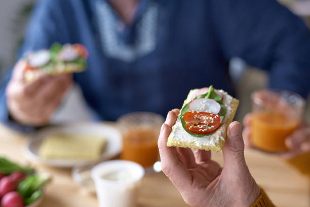 istock Senior woman eating sandwich with vegetables 1768244358