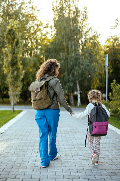 istock Mother taking her daughter to school 1768244382
