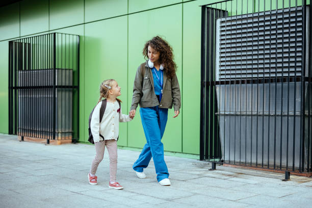 istock Mother taking her daughter to school 1768244401