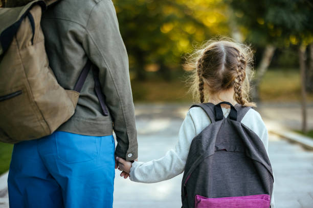 istock Mother taking her daughter to school 1768244402