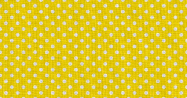 istock white yellow color polka dots fabric 1768245466