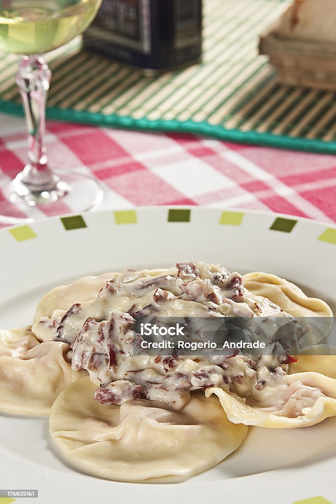 Ravioli with pumpkin sauce. Food photography. Italian cuisine accompanied by pumpkin sauce. Back Lit Stock Photo