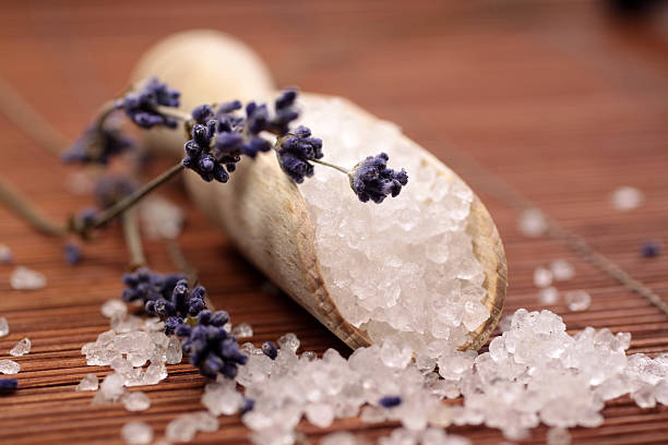 istock Small wooden shovel with bath salts on reed background 176825658