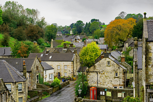 A row of houses on Gold Hill, an old street in Shaftesbury England.  Taken on a cloudy/rainy day and processed to enhance the dramatic tones.