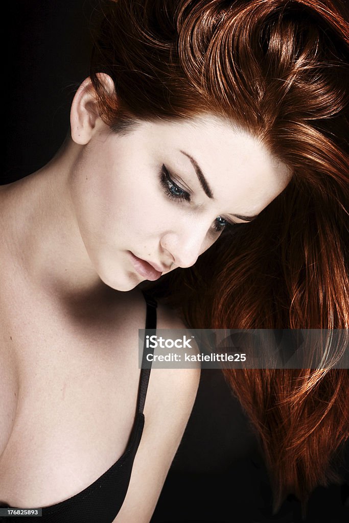 Sad Woman An pretty young woman holidng her head down as if she is sad. Adult Stock Photo