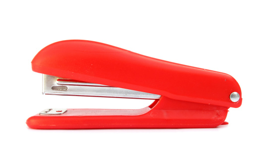 This is a red stapler machine.