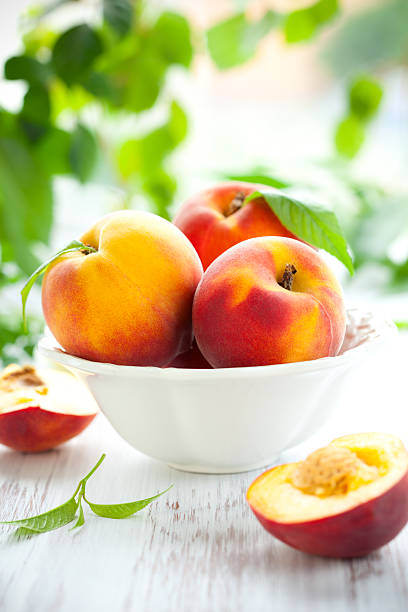 istock Bowl of fresh peaches on table 176826868