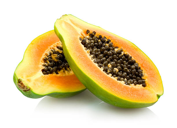 istock A ripe papaya cut in half showing seeds on white background 176827735