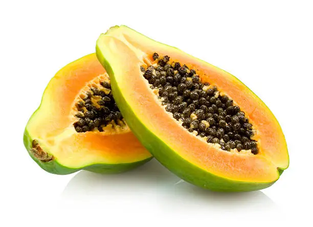 fresh halves of papaya isolated on white background
