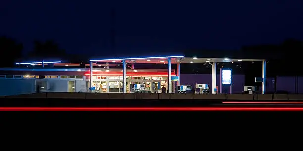 Photo of Low light service station caught highlighting blue/red hues