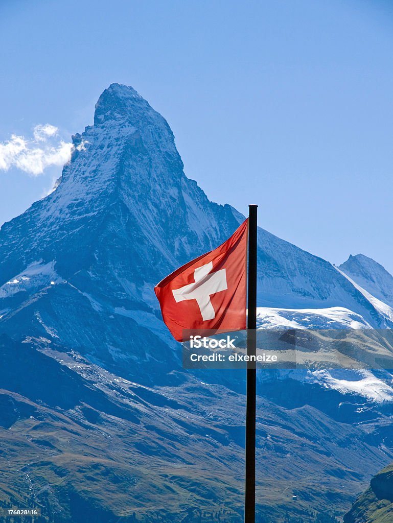 Swiss flag with the Matterhorn The swiss flag with the Matterhorn in the back Switzerland Stock Photo