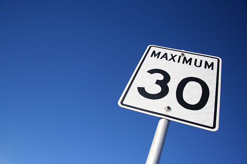 maximum 30 sign against blue sky