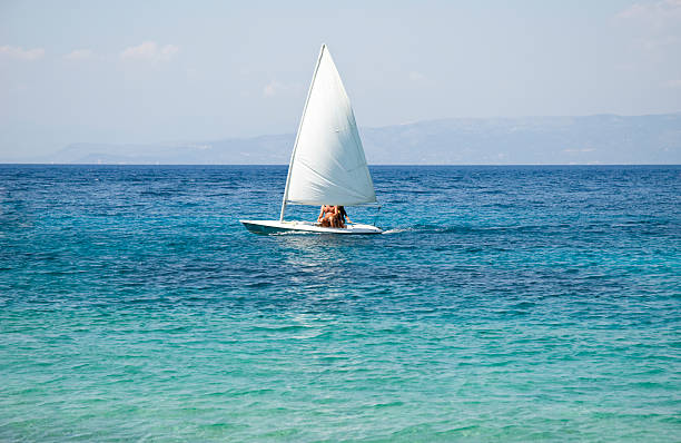 small sailing boat stock photo