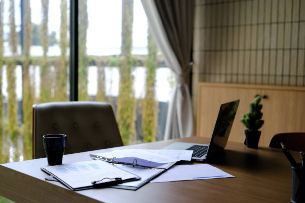 istock Manager working desk with laptop computer, document, paperwork and office suppliers. 1768308238