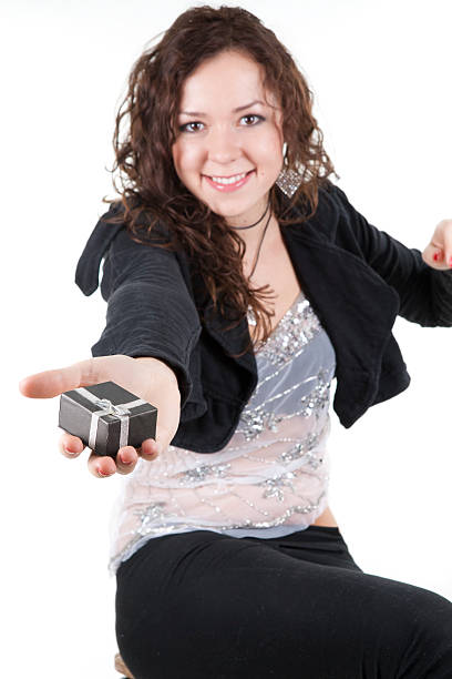 cherfull young lady and gift on white background stock photo