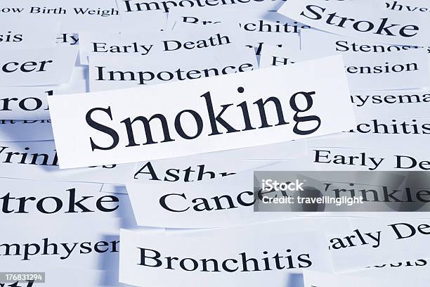 Several Pieces Of Paper With Smoking And Cancer Words Stock Photo - Download Image Now