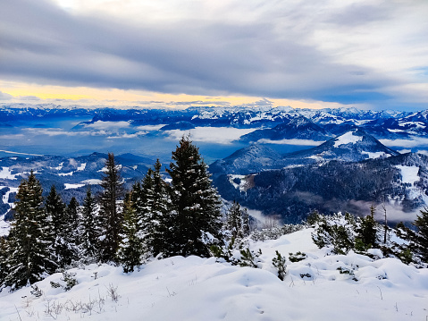 Beautiful winter mountain landscape in Tyrol.  View of the Inner Alps.  Gray clouds, a small glimmer of light.