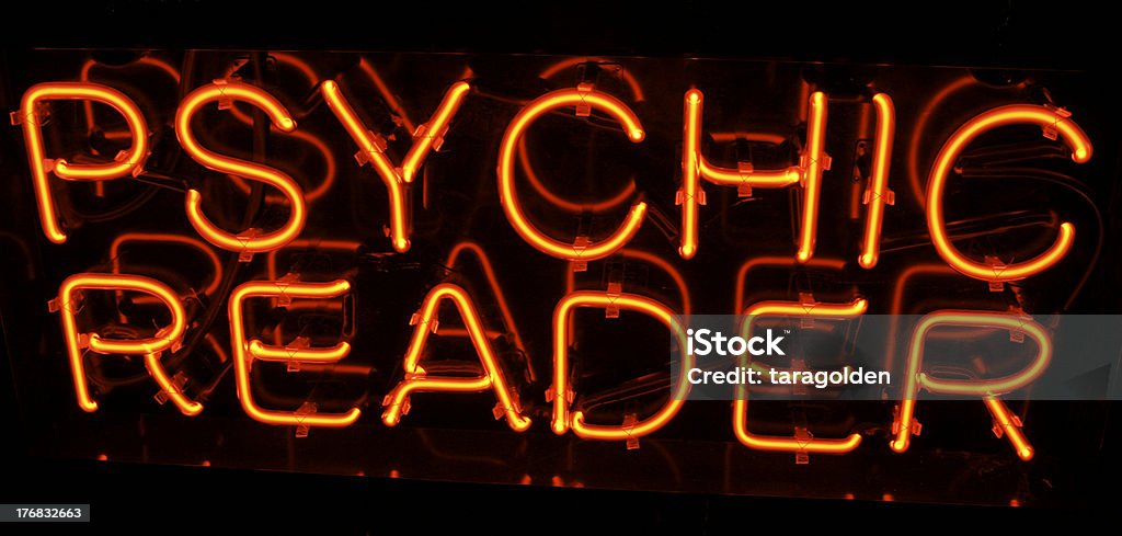 Red Neon Psychic Reader sign "Red neon Psychic Reader sign lights up the night.shot in Sedona,Arizona." Business Stock Photo