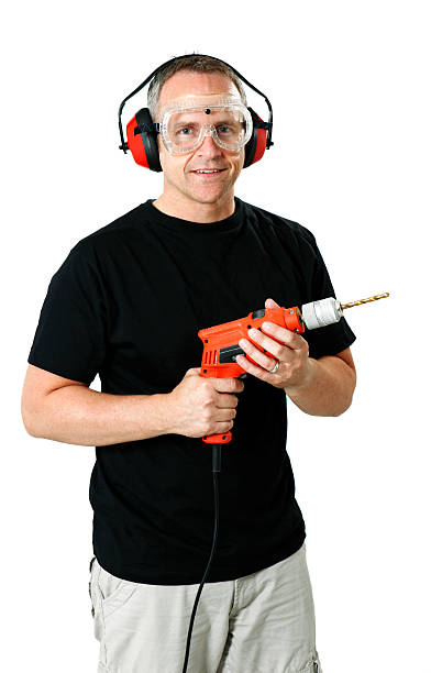 istock Man Holding Drill Wearing Safety Gear 176833565