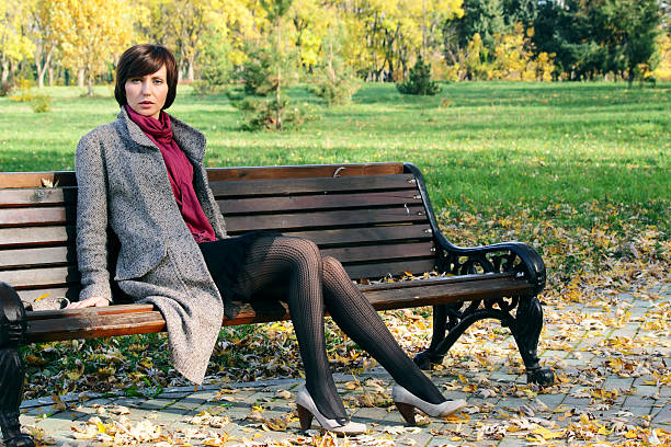 istock Girl in the park on a bench 176834088