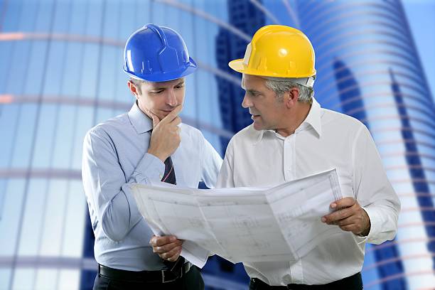istock Engineer and architect wearing hard hats and planning 176834517