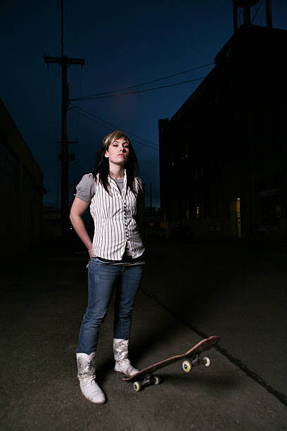 istock Girl on SkateBoard At Night. 176835208