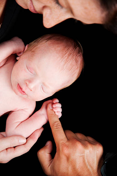 istock Newborn Baby Grasping Finger 176835836