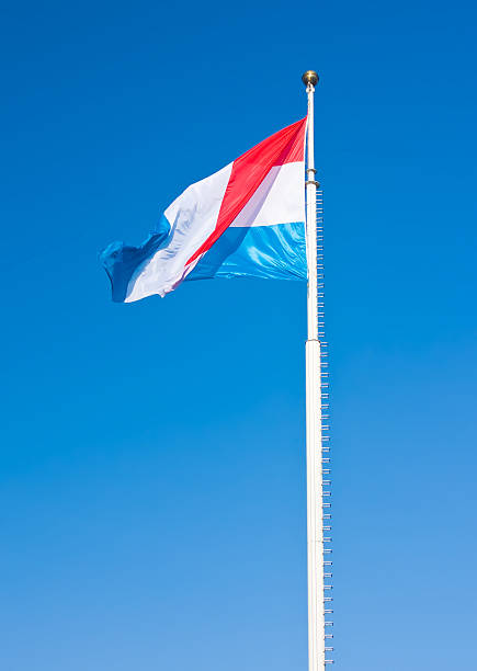istock Flag of Luxembourg over blue sky 176837150