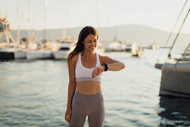 istock Woman exercising and checking her smartwatch in a seaport 1768373053