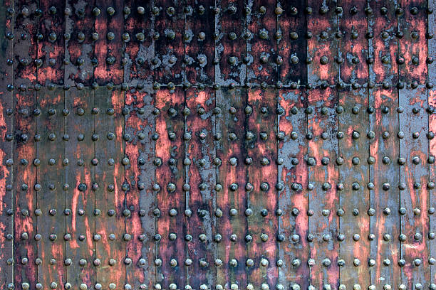istock wooden door riveted and corroded 176837439