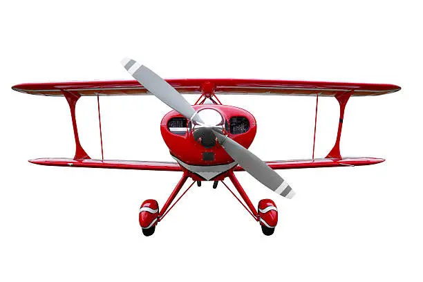 A red biplane isolated on a white background.