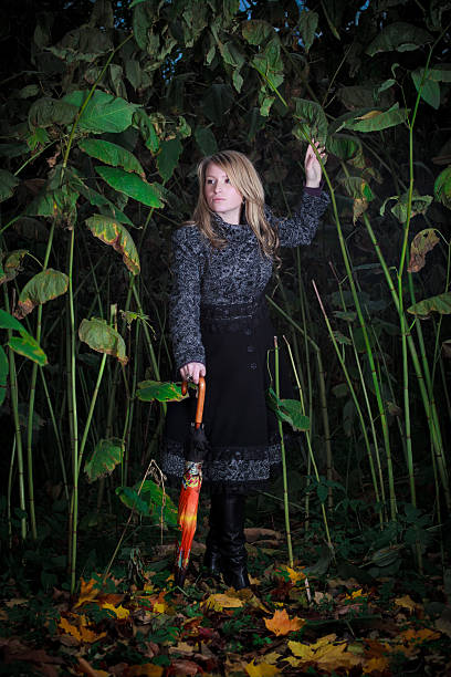 istock girl walk in enchanted forest 176837592