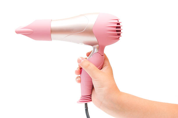istock Compact pink hairdryer in hand 176837728