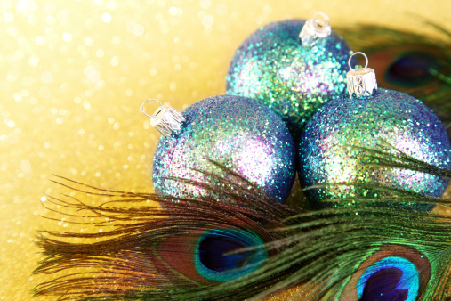 Colorful baubles with peacock feathers