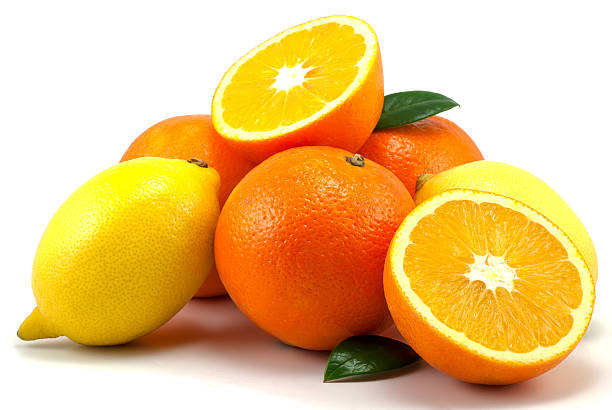 istock Oranges and lemons in a pile against a white background 176838852