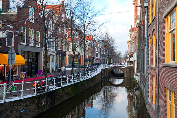 Delft residential district Houses and Canal in Delft residential district. horizontal shot delft winter netherlands snow stock pictures, royalty-free photos & images