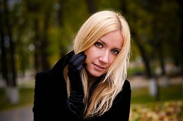 istock woman in autumn park 176839104