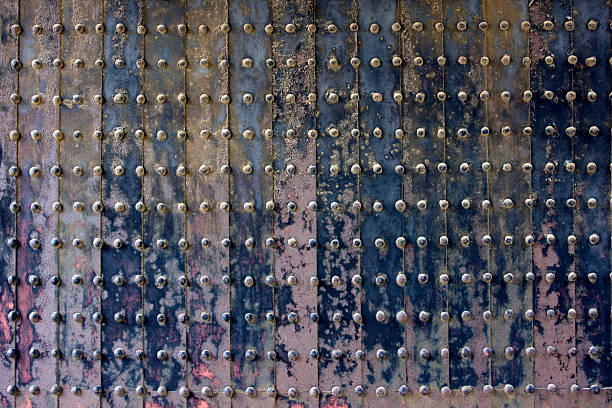 istock wooden door riveted and corroded 176839379