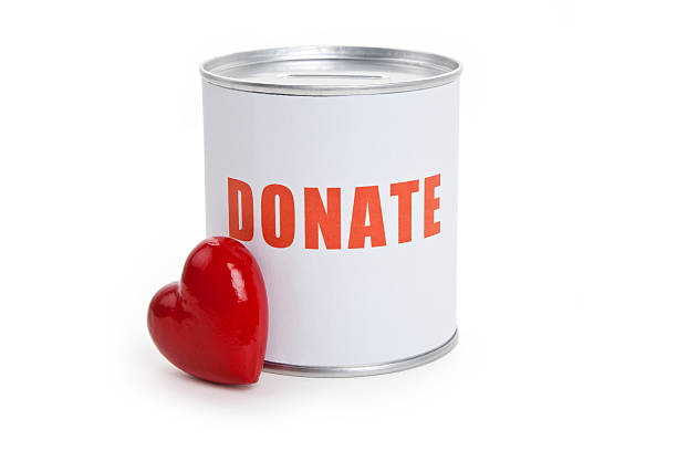 istock White donate can with small red heart leant on it 176839458