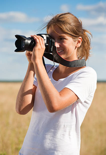 istock girl taking photo with camera 176839493