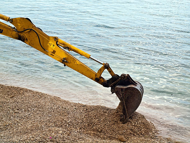 istock Excavator digging near the sea 176839631